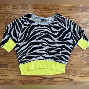 Black Rivet zebra print sweater with neon yellow sleeves